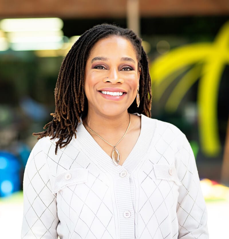 Dr. Zakiyah Woods smiling confidently